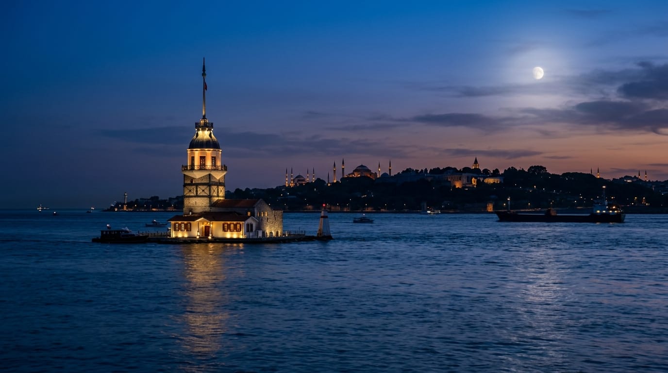 The Maiden's Tower at twilight with the domes and minarets of Istanbul's old city silhouetted on the horizon behind it